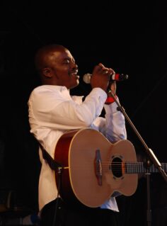 Yourg man with guitar singing